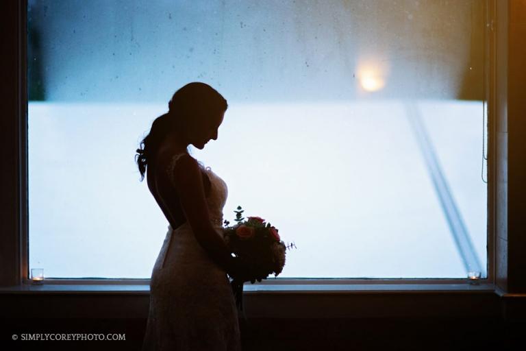 Atlanta wedding photographer, silhouette of a bride by a large window