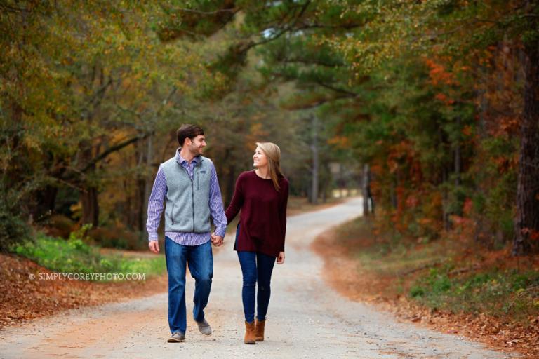 Atlanta couples photographer, walking on a country road in the fall