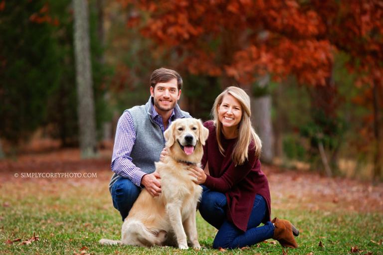 Carrollton pet photographer, couple with Golden retriever outside in the fall