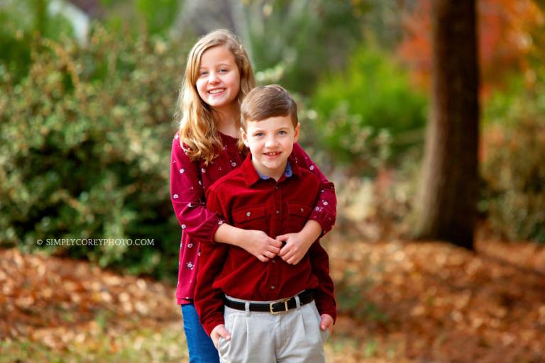 Douglasville family photographer, fall photo of siblings outside