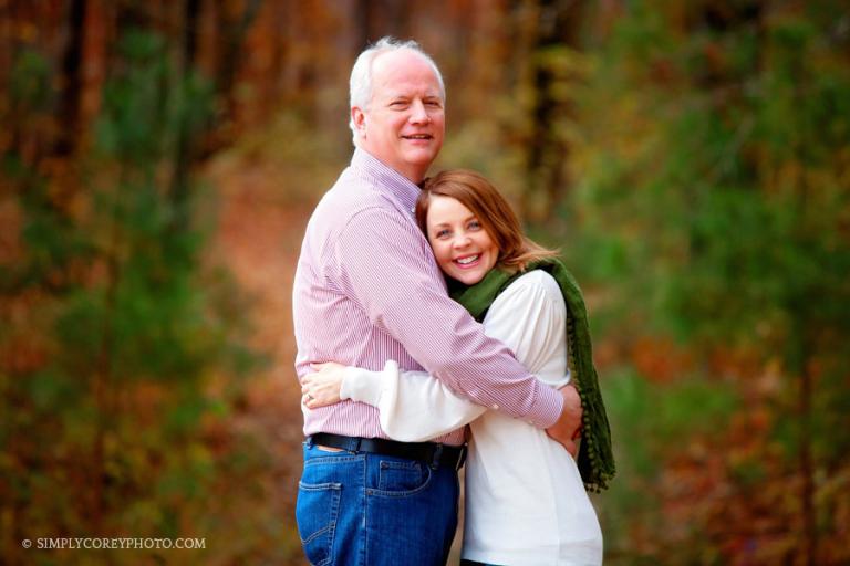 Villa Rica couples photographer, mom and dad hugging outside