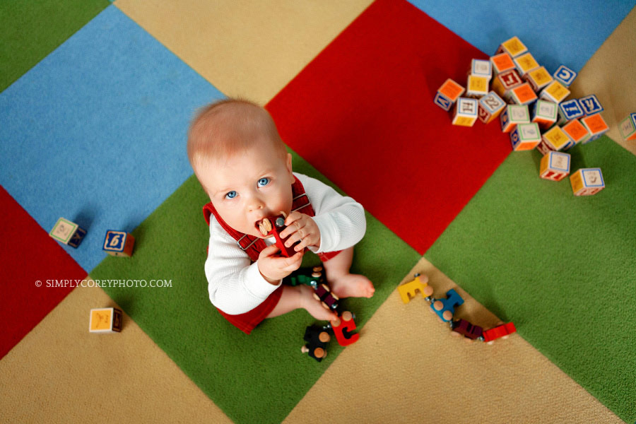 Atlanta baby photographer, baby sitting on a colorful block rug