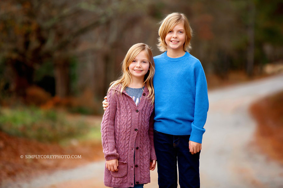 Douglasville family photographer, two children outside on country road