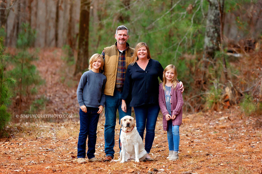 family photographer near Carrollton, Georgia; fall portrait outside with family dog