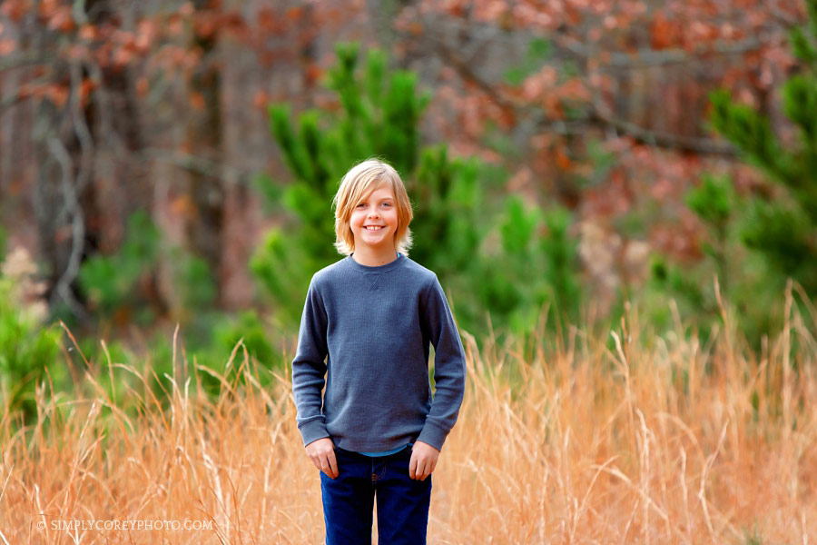 Villa Rica children's photographer, child outside in a golden field