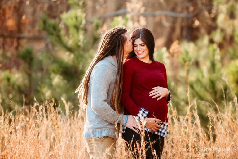 Atlanta maternity photographer, man with dreads kissing pregnant wife
