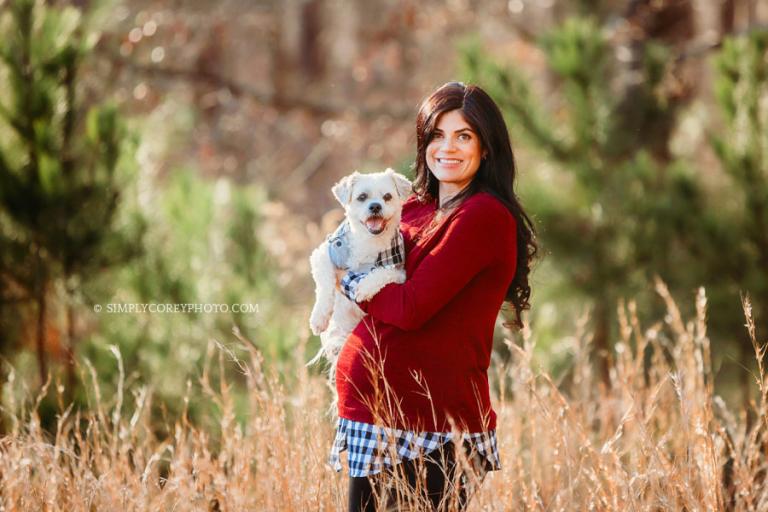 Villa Rica maternity photographer, pregnant mom holding dog outside