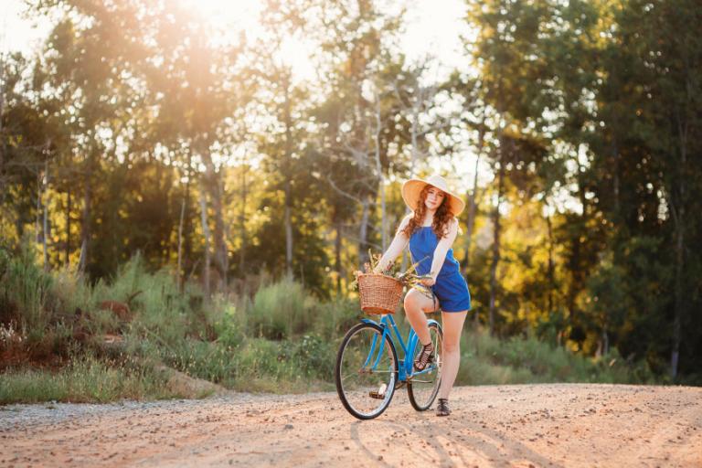 Douglasville senior portrait photographer, teen in floppy hat with a vintage bike