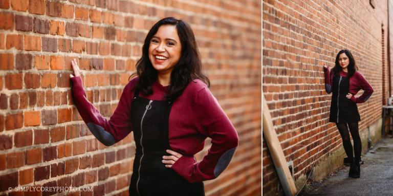 senior portrait photographer near Douglasville, teen girl by brick wall