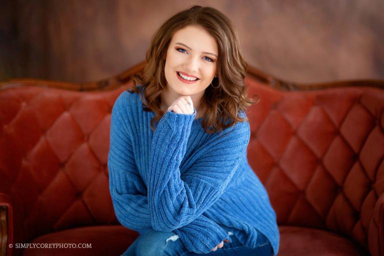 Carrollton senior portrait photographer, teen girl on a couch in studio