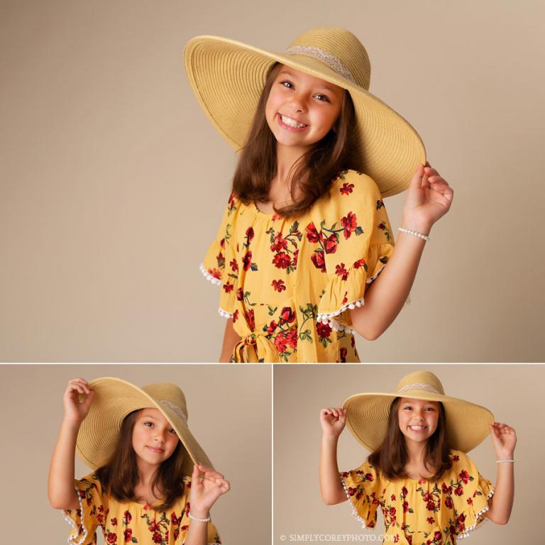 children's photographer near Villa Rica, studio portraits of a girl in a floppy hat