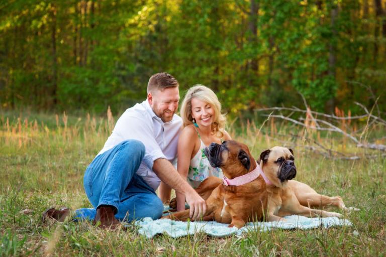 pet photographer Villa Rica, couple outside with English Mastiffs