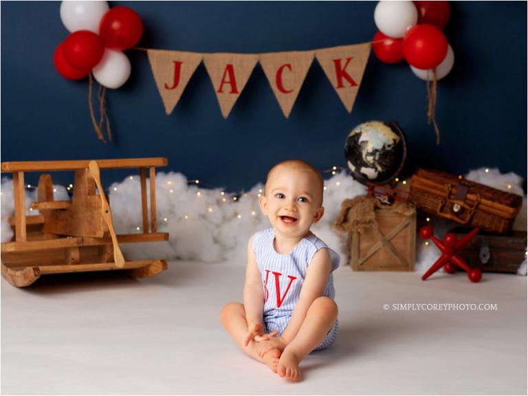 Douglasville baby photographer, boy in monogrammed jon jon in studio