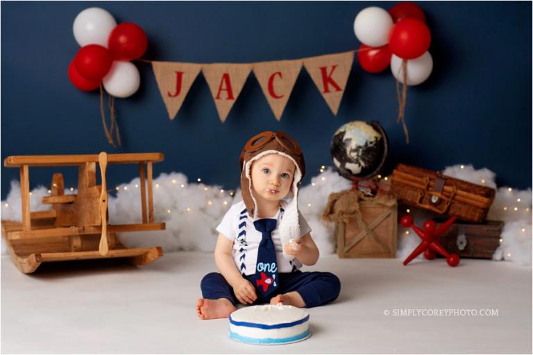 Atlanta cake smash photographer, baby boy in studio with an airplane theme