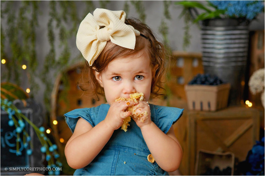 Newnan cake smash photographer, baby eating lots of cake