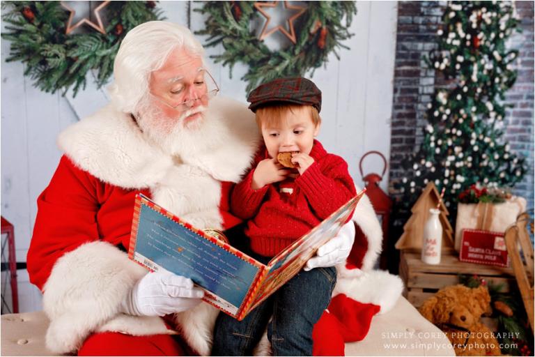 Carrollton Santa Claus mini session photographer, Santa reading to a boy with a cookie