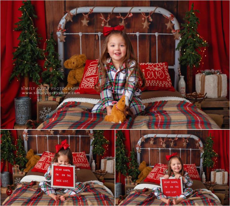 Christmas mini session photographer near Carrollton, GA; girl with a letter board