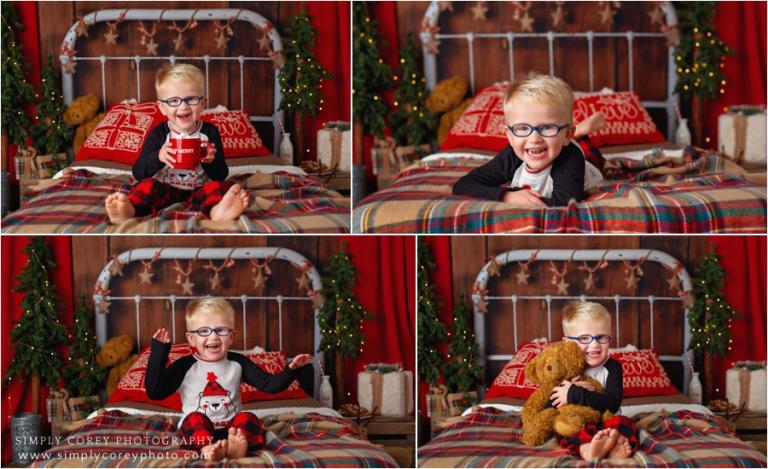 Christmas pajama mini session photographer, boy with glasses on a bed