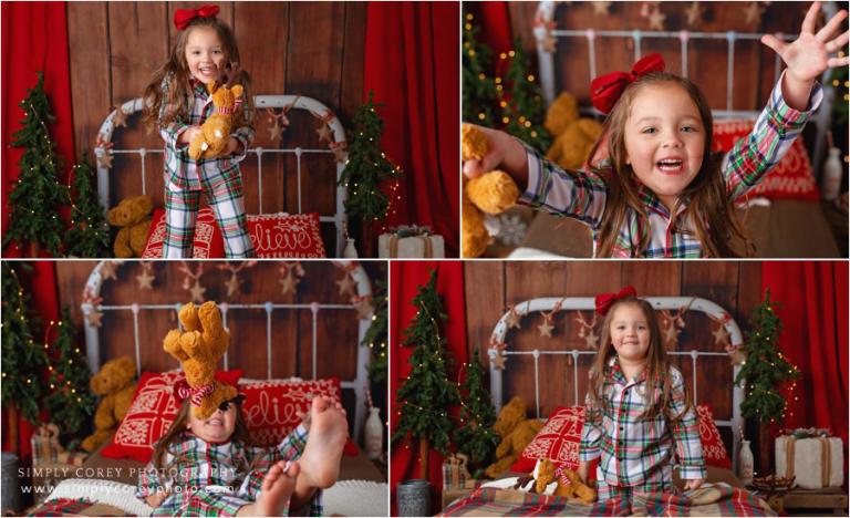 Christmas mini session photographer near Villa Rica, girl jumping on bed