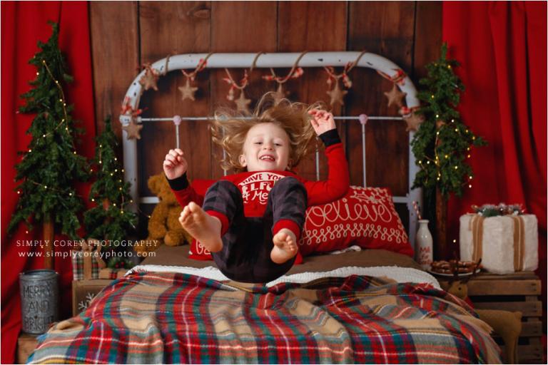 West Georgia Christmas pajama mini sessions, kid jumping on a bed