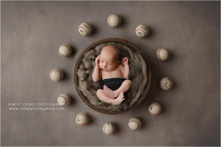 Atlanta newborn photographer, baby boy in bowl with baseballs