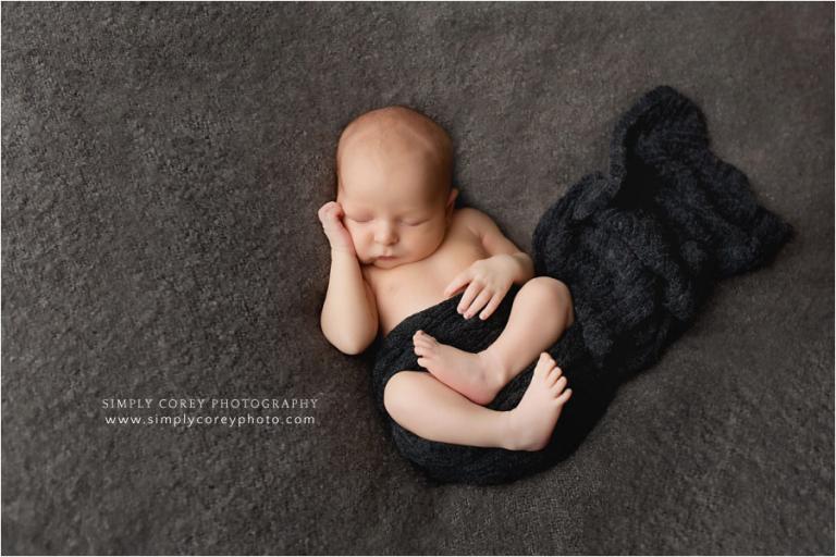 Carrollton newborn photographer, studio session of boy in knit wrap