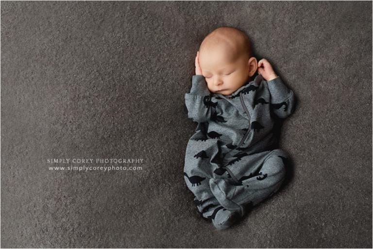 West Georgia newborn photographer, baby in grey dinosaur sleeper