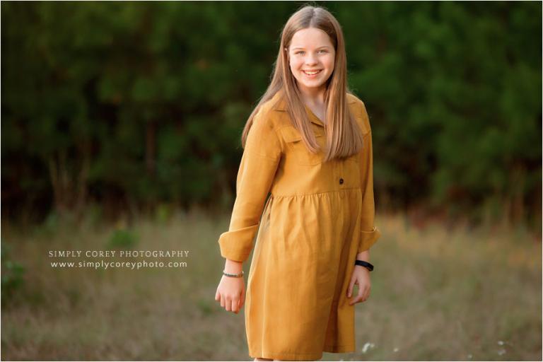 Douglasville photographer, tween girl wearing a gold dress for a fall mini