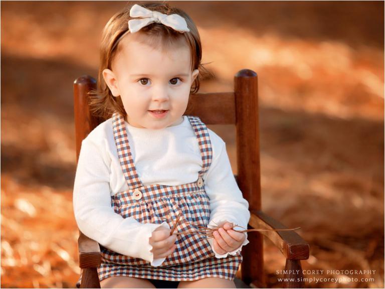 Villa Rica baby photographer, toddler girl in rocking chair