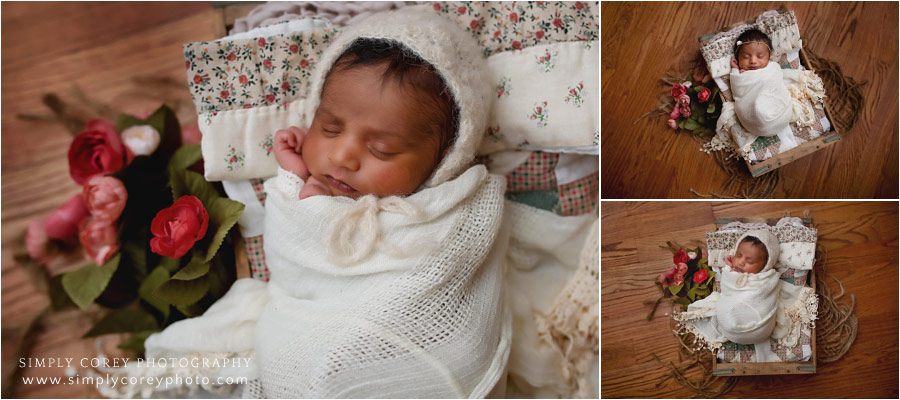 West Georgia newborn photographer, baby in lace with flowers and quilt