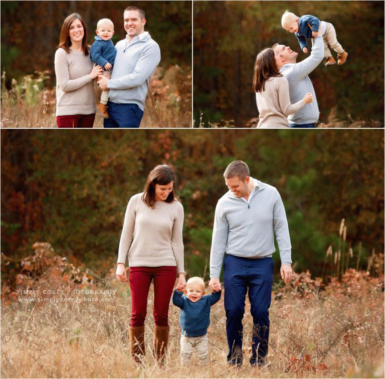 Carrollton family photographer, parents playing with baby in field