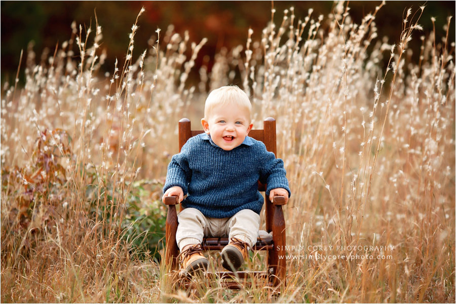 Newnan baby photographer, toddler in chair by tall golden grass