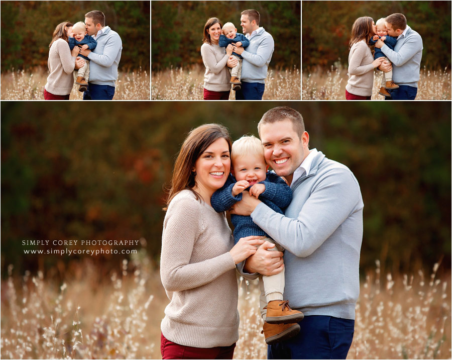 Newnan family photographer, parents snuggling baby boy outside