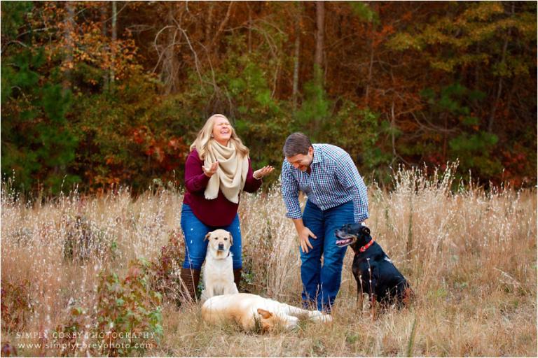 Atlanta pet photographer, funny outtake with a couple and 3 dogs outside