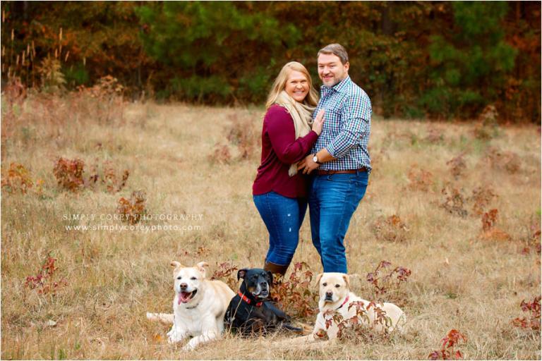 Newnan pet photographer, couple outside with three dogs