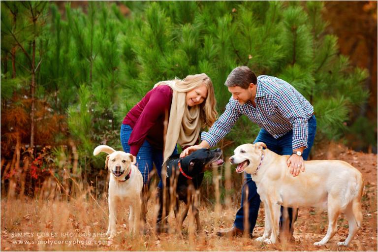 West Georgia pet photographer, couple petting three dogs outside