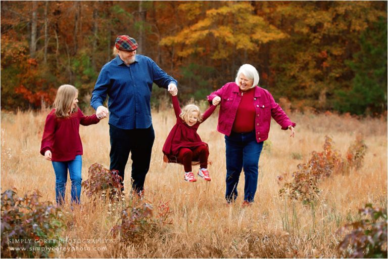 Atlanta family photographer, kids with grandparents in a field in autumn