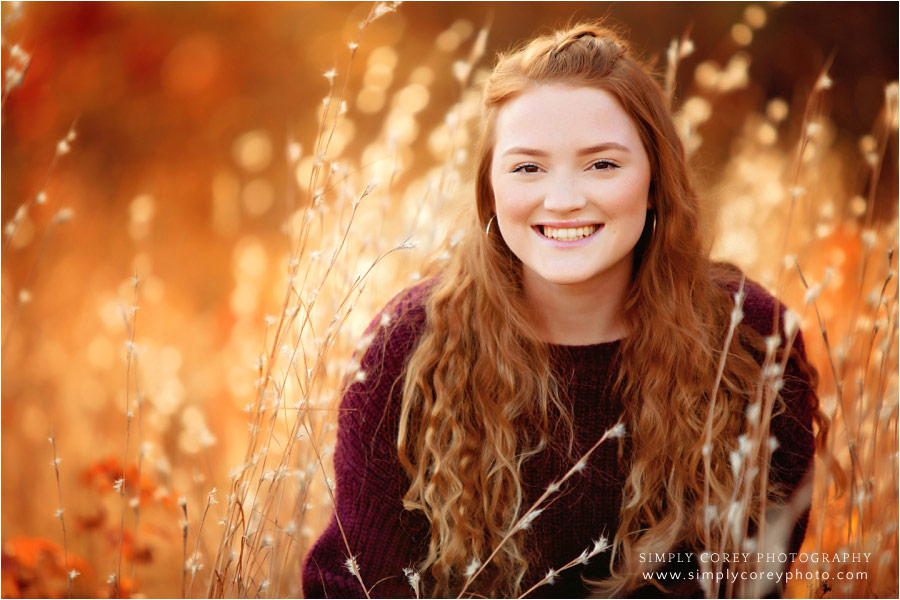 Atlanta senior portrait photographer, teen in golden fall field