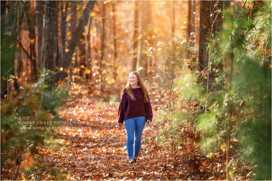 Bremen senior portrait photographer, teen walking in fall leaves