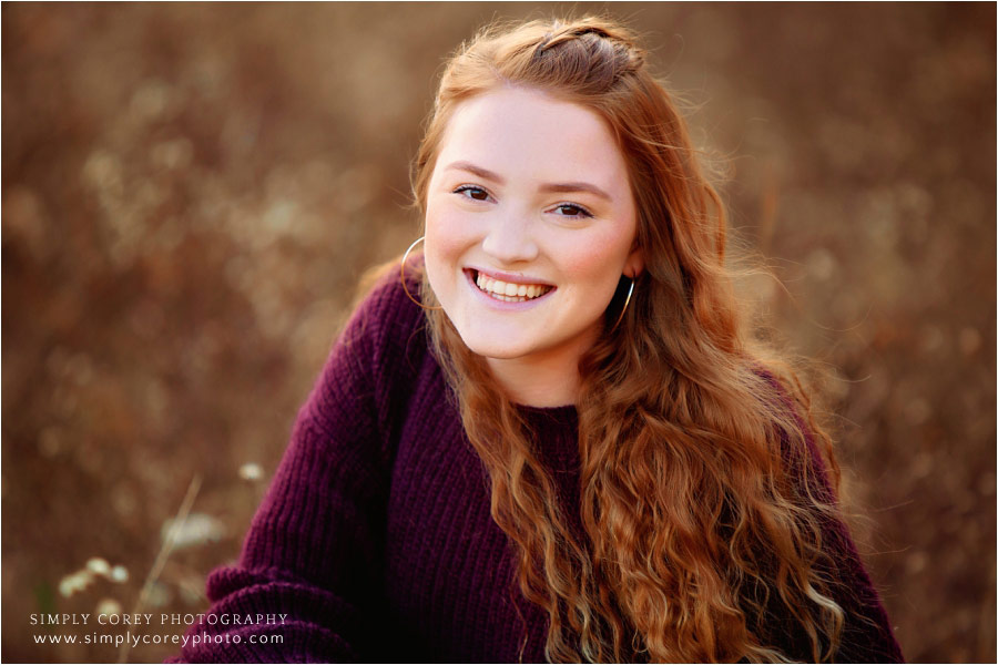 Carrollton senior portrait photographer, teen outside in fall field