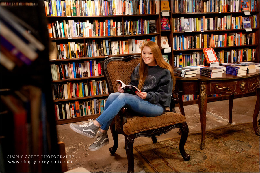 Douglasville senior portrait photographer, teen reading in Carrollton bookstore
