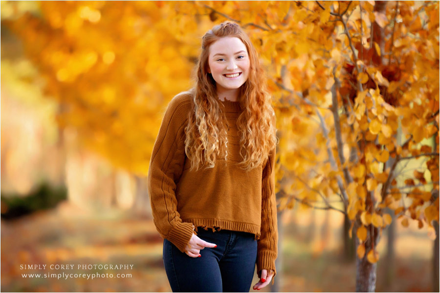 Newnan senior portrait photographer, redhead teen girl with yellow fall leaves