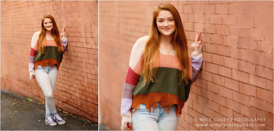 West Georgia senior portraits, teen downtown by a brick wall