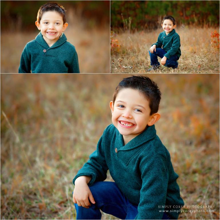 Douglasville children's photographer, child smiling outside in fall field