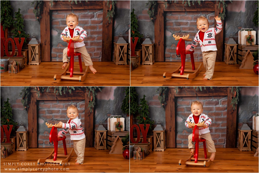 Carrollton Christmas mini session, baby by fireplace with moose