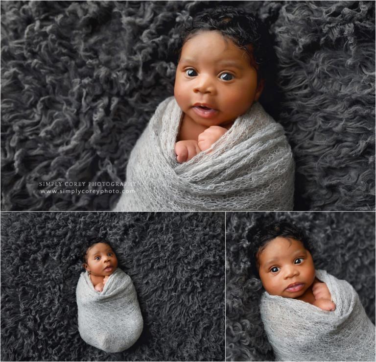 Douglasville newborn photographer, baby boy awake on gray fur