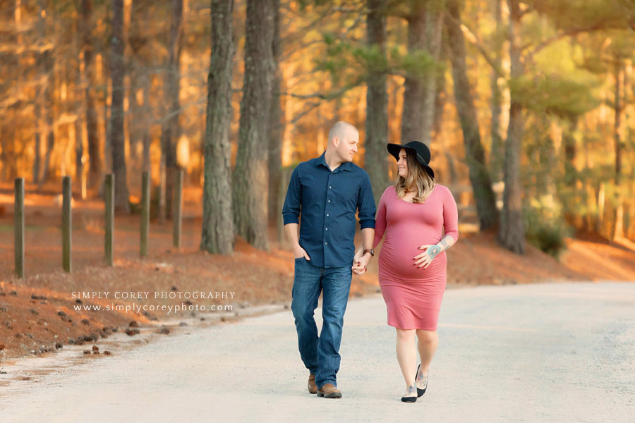 Peachtree City maternity photographer, couple walking on country road