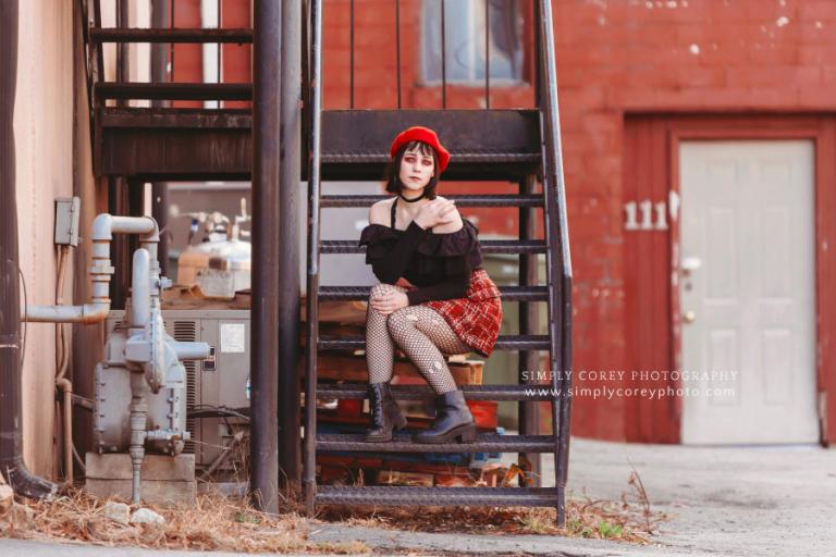 Douglasville photographer, girl in red makeup on stairs during urban session