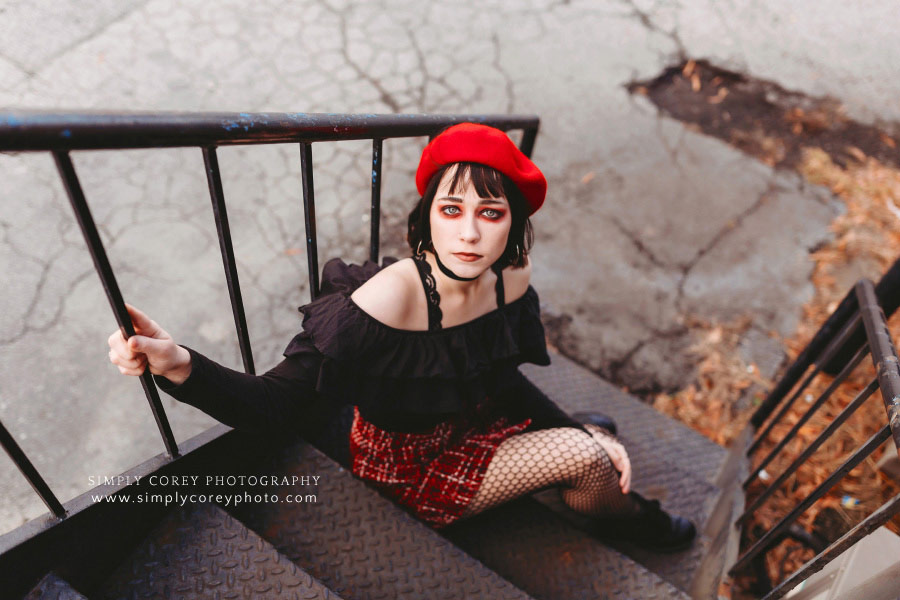 Newnan photographer, girl in red makeup on stairs downtown