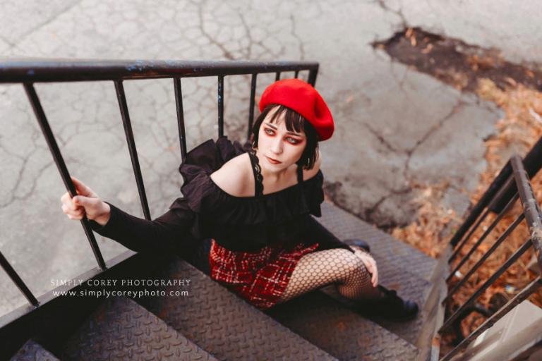 Villa Rica photographer, girl in red eyeshadow on stairs during urban session